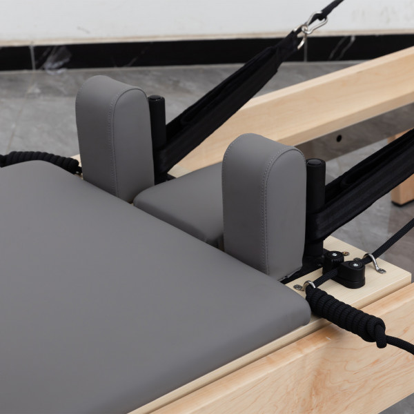 Close-up of shoulder rests and ropes on the Skelcore Classic Reformer - American Maple