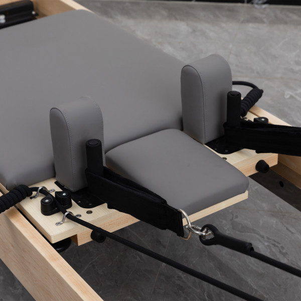 Close-up of double-loop straps and shoulder blocks on the Skelcore Classic Reformer - American Maple