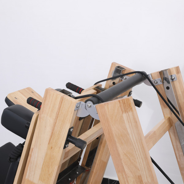 Top view of folded Skelcore Foldable Reformer - Oak showing pulleys and handles