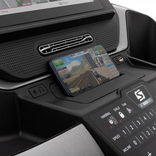 Close-up of the phone rack on the SPIRIT XT685 ENT Treadmill.