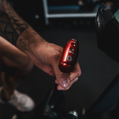 Lifestyle image of a model using the STEPR Bionic Bike XL resistance gearstick