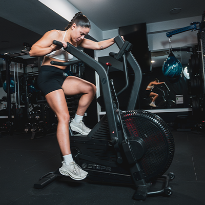 Lifestyle image of a model using the STEPR Bionic Bike XL