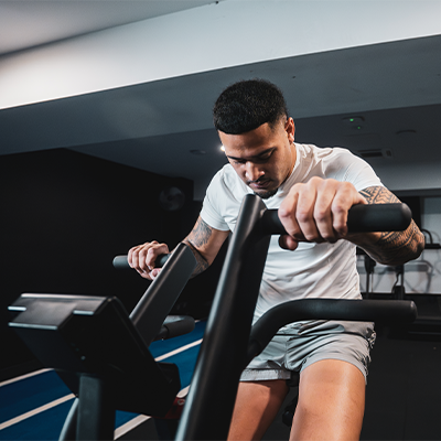 Close-up lifestyle image of a model using the STEPR Bionic Bike XL