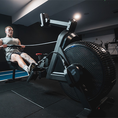 Image of a model rowing with the STEPR Rower XL