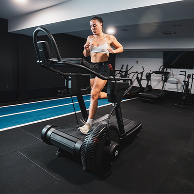 Lifestyle image of a model using the STEPR TreadSled XL