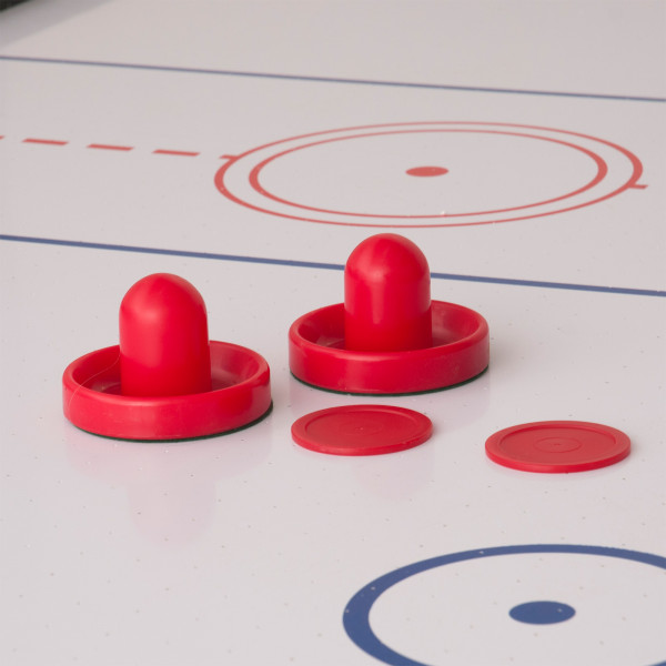 Close-up of the air hockey pushers and pucks on the Sure Shot 4-in-1 7ft Multi Games Table.