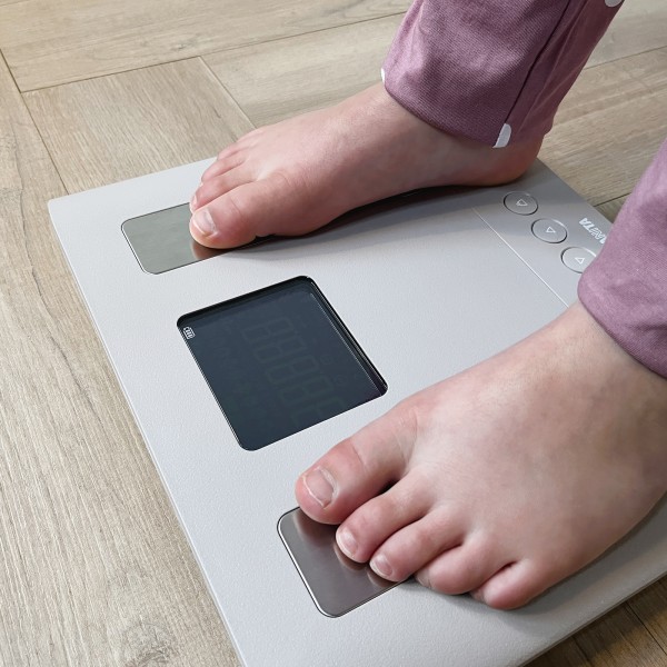 child standing on TANITA BC-333LE scales