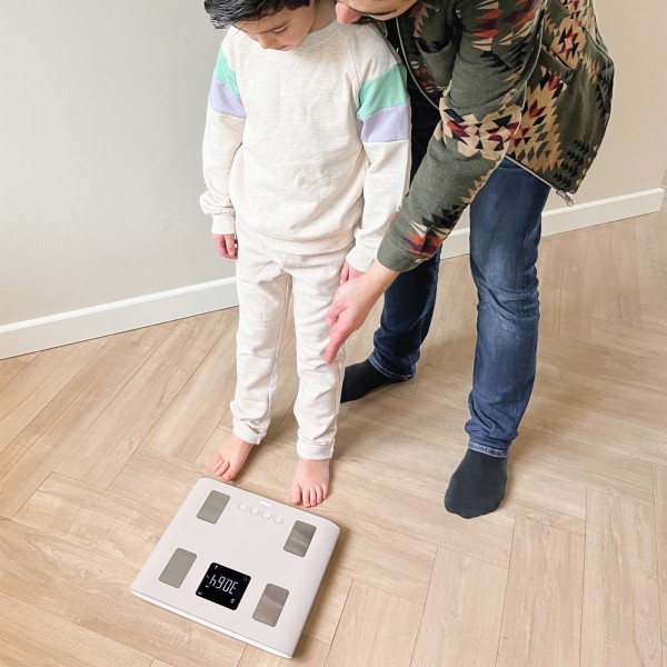 Image showing a father and son using the TANITA BC-333LE