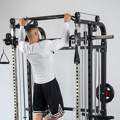 Person doing a pull-up on the Taurus MS20 Pro Plate Complete Trainer.