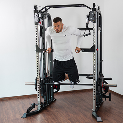 Person doing a triceps dip using the Taurus MS20 Pro Plate Complete Trainer.