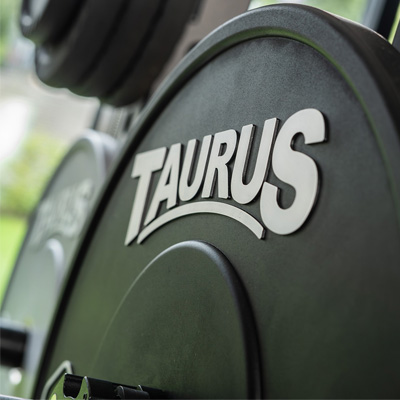 A close-up of the Taurus Black Bumper Olympic Plates