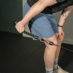 Person training with the Taurus Single Tricep Rope.