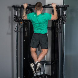 Person using pull-up bar on Taurus Elite Dual Adjustable Pulley