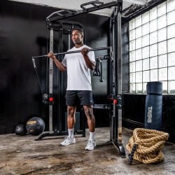 Model performing cable bar exercise