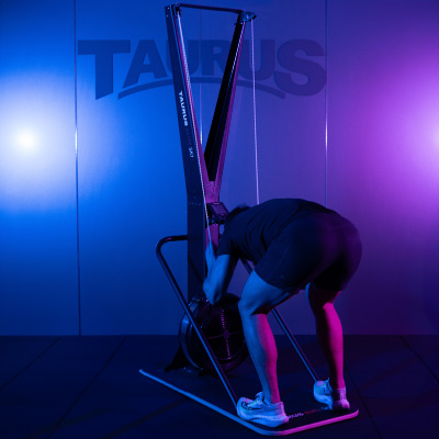 User preparing for a pull movement on the Taurus Elite Ski Trainer