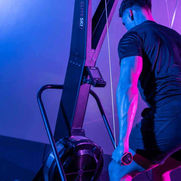 Side view of user training on the Taurus Elite Ski Trainer