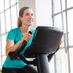 Woman cycling on the Taurus UB9.9 Upright Bike