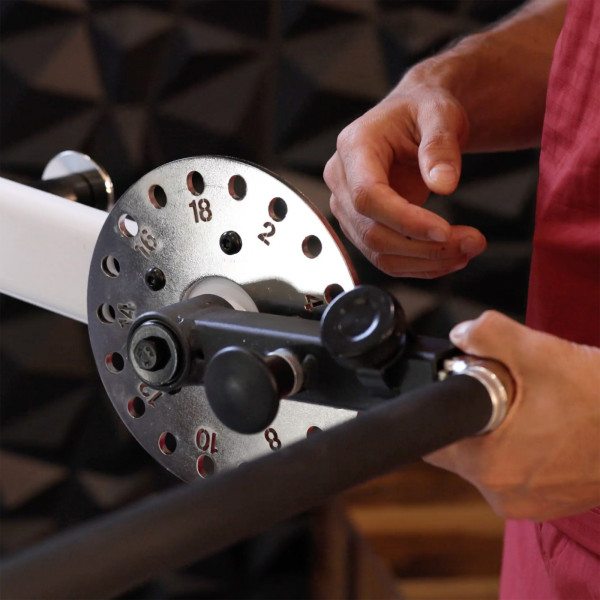 Image of a model adjusting the handle of the Taurus Flexicon Resistance Trainer