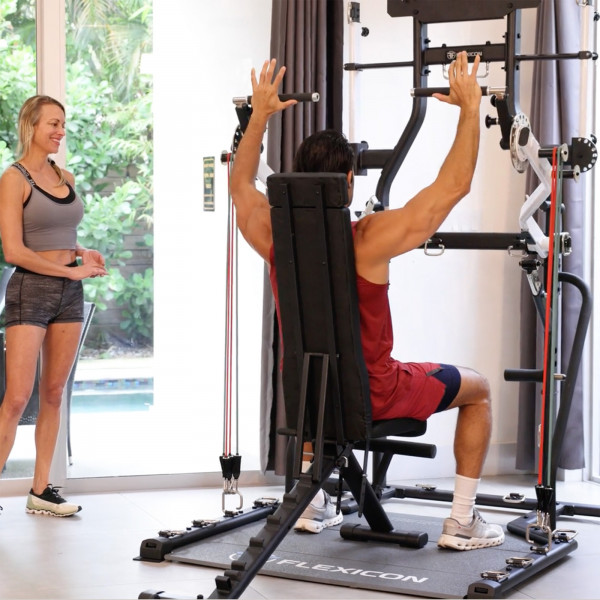 Image of a model using the Taurus Flexicon Resistance Trainer to train shoulder press