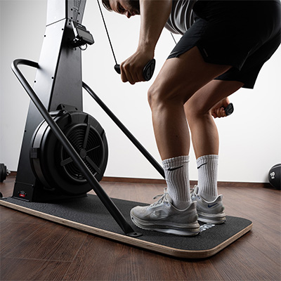 Close-up of a model performing a bent-over pull on the Taurus Elite Ski Trainer Pro 