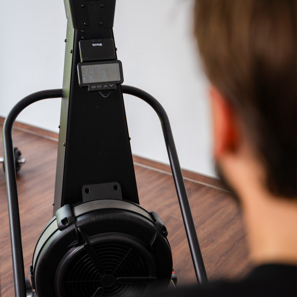 Over-the-shoulder detail shot of the workout console and flywheel on the Taurus Elite Ski Trainer Pro