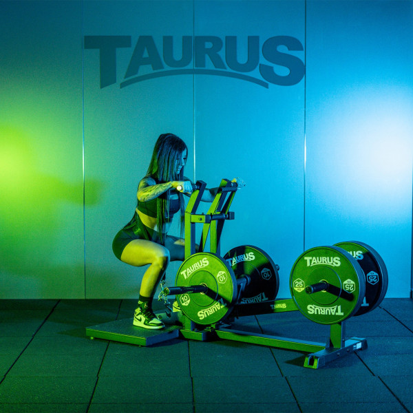 Model squatting on the Taurus Pro Iso Belt Squat