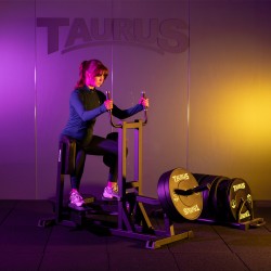 User mid-rep on the Taurus Pro Iso Standing Hip Abductor in seated setup
