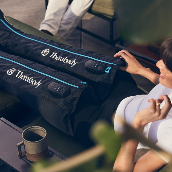 Therabody RecoveryAir JetBoots in use during relaxation.
