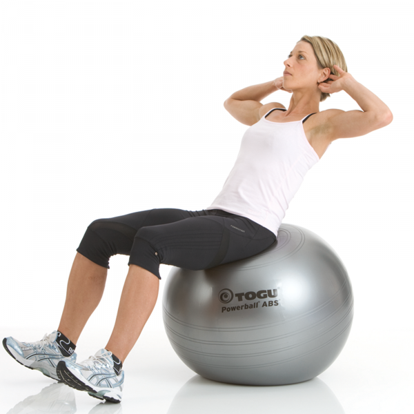 A women doing exercise with TOGU Powerball ABS