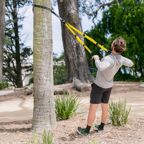 TRX Burn - Outdoor workout against a tree
