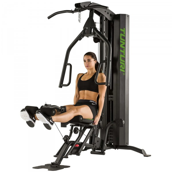 User performing a leg extension on the Tunturi HG60 Multi Gym.