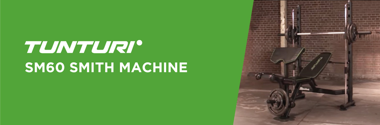 Tunturi SM60 Smith Machine product banner showing the machine set up in a brick-walled training space