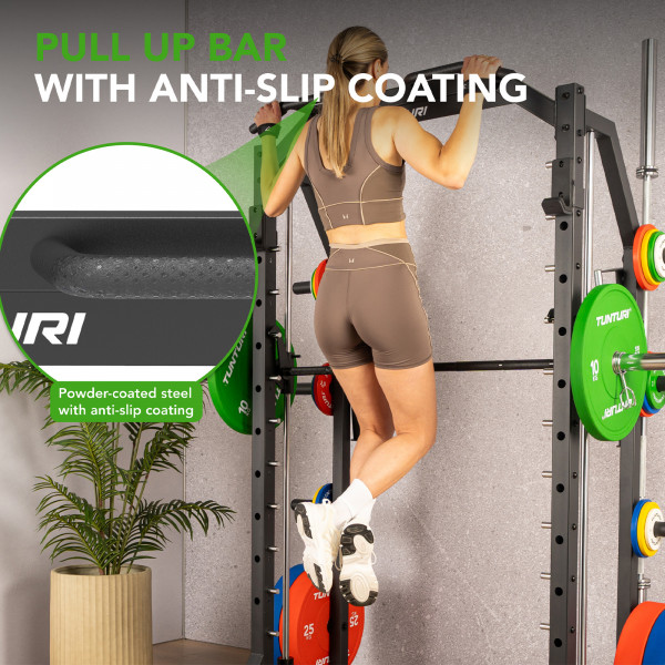 Product image of the Tunturi SM70 Smith Machine with a model using the Pull-up bars