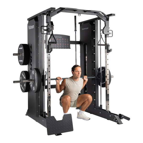 Image of a model using the Tunturi Platinum Full Smith/Functional Trainer for Smith machine squats