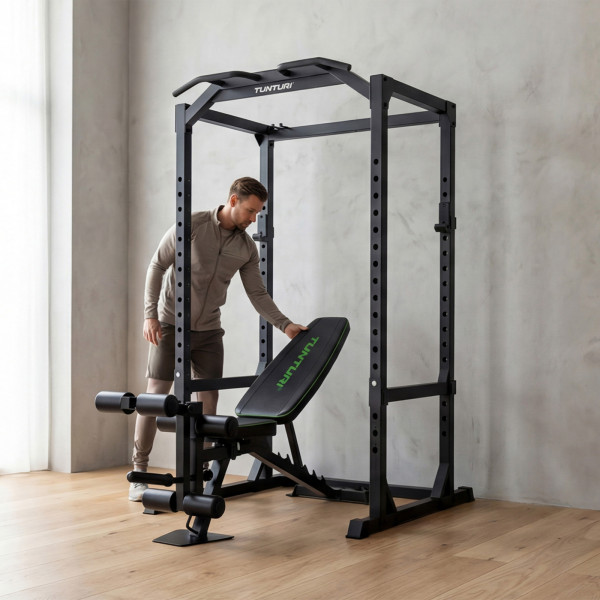 Tunturi UB60 Weight Bench - Lifestyle Image - Model setting up bench for a power rack workout