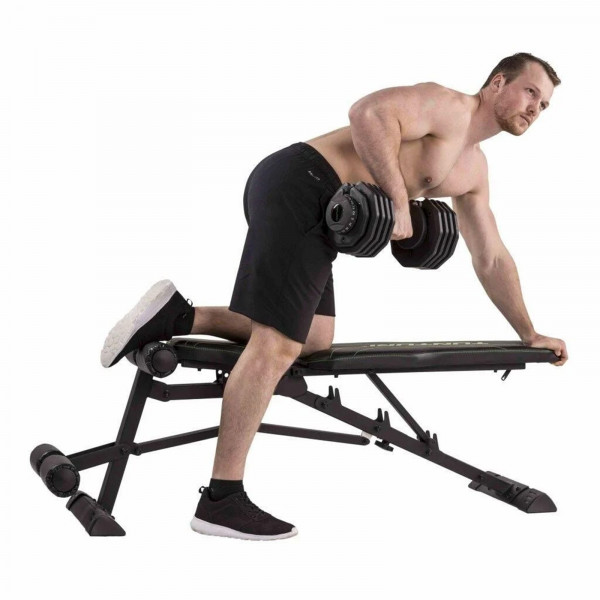 Model performing a dumbbell row on the Tunturi UB80 Weight Bench