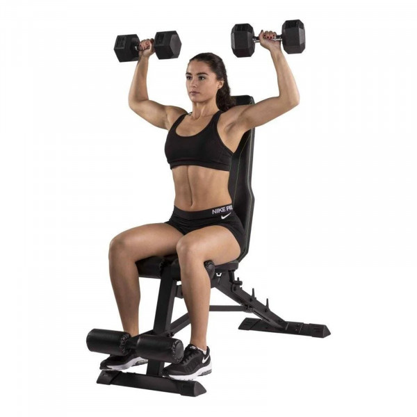 Person performing shoulder press on the Tunturi UB80 Weight Bench