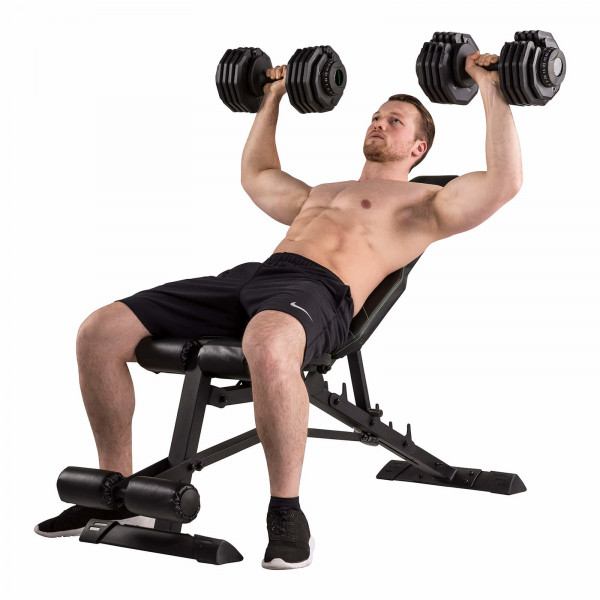 Person performing dumbbell press on the Tunturi UB80 Weight Bench