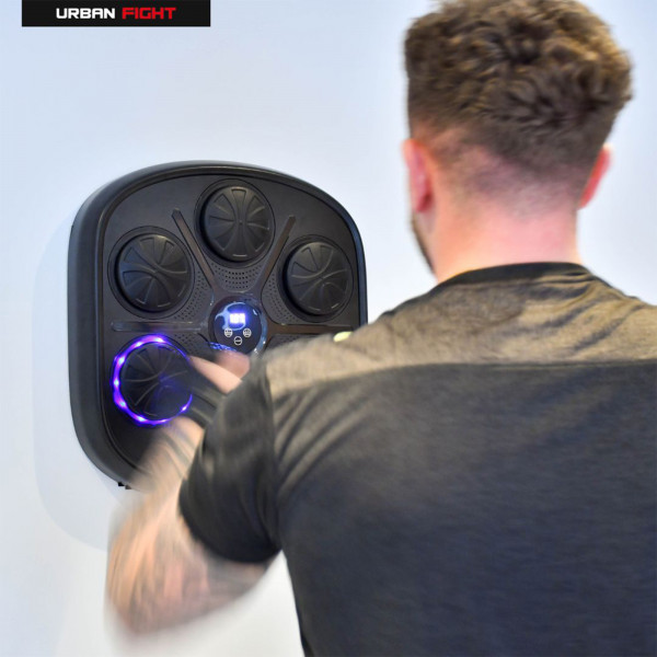 Urban Fight boxing machine with user training on wall