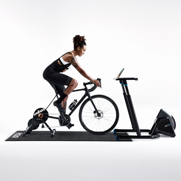 Full indoor setup with Wahoo trainer, Zwift Cog, and rider using Zwift