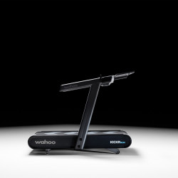 Side view of the Wahoo KICKR RUN Smart Treadmill on dark background