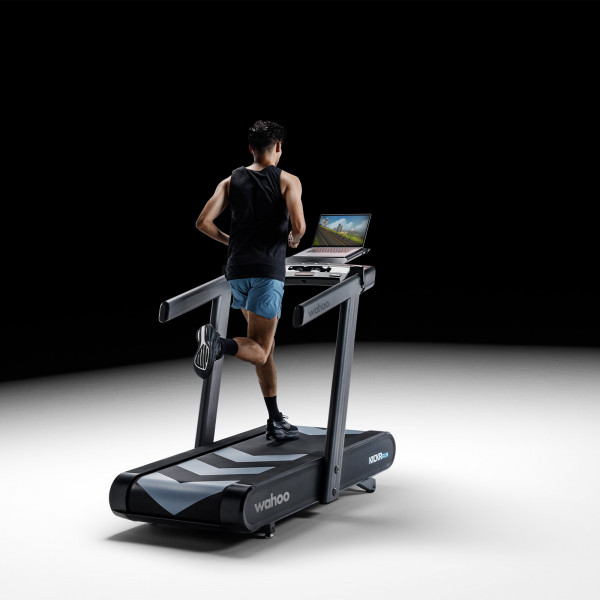 User running on Wahoo KICKR RUN Smart Treadmill with Zwift on screen