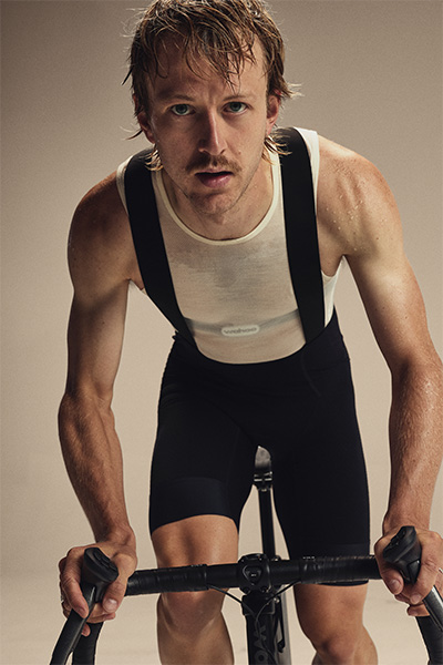 Model riding the Wahoo KICKR BIKE PRO in aero position