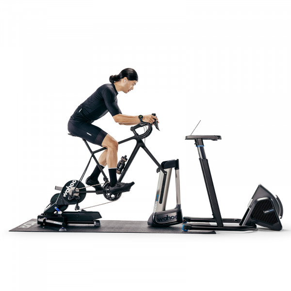 Full indoor training setup with the Wahoo KICKR MOVE Smart Trainer, CLIMB, and accessories.