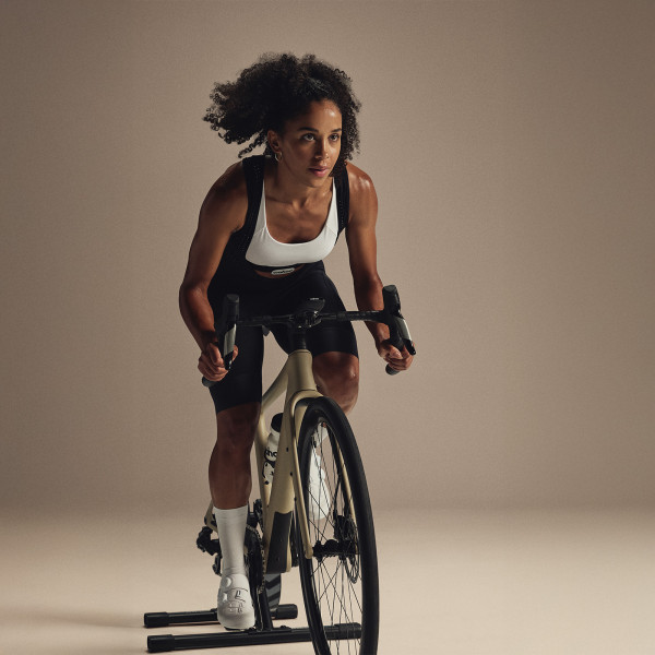 Person riding indoors on the Wahoo KICKR CORE 2 trainer front view