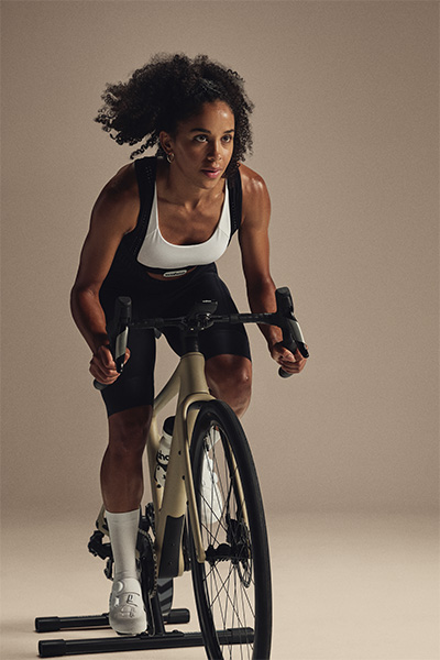 Person riding indoors on the Wahoo KICKR CORE 2 trainer front view