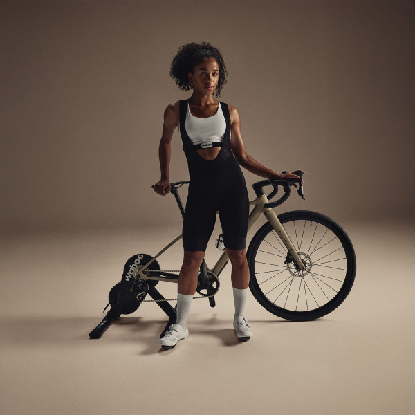 Person standing with bike on the Wahoo KICKR CORE 2 trainer