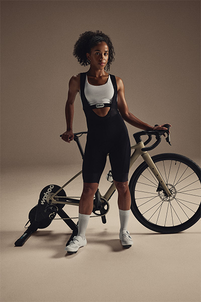 Person standing with bike on the Wahoo KICKR CORE 2 trainer