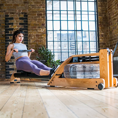 Model rowing on the WaterRower Hybrid Rowing Machine indoors 