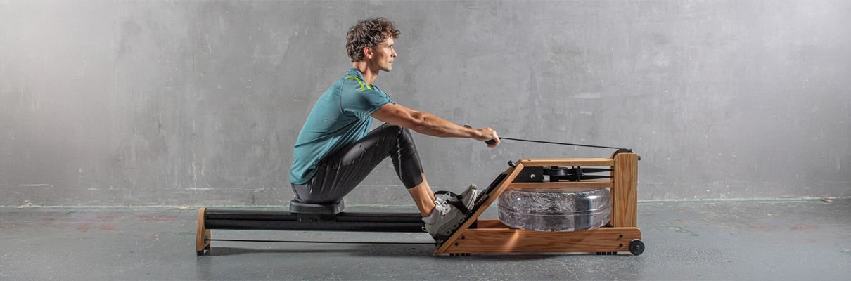 Model demonstrating the rowing motion on the WaterRower Hybrid Rowing Machine